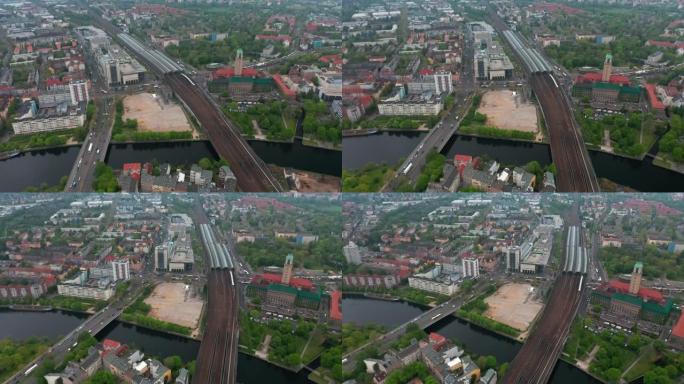 Spandau火车站的滑动和平移镜头与长车棚在多轨铁路线路。小镇的高角度视图。柏林,德国