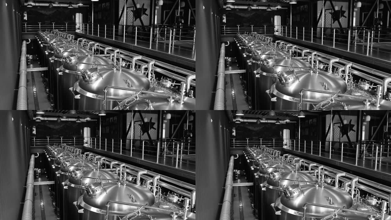 私人微型啤酒厂精酿啤酒生产线。现代啤酒厂，配有不锈钢酿造水壶、管子和罐