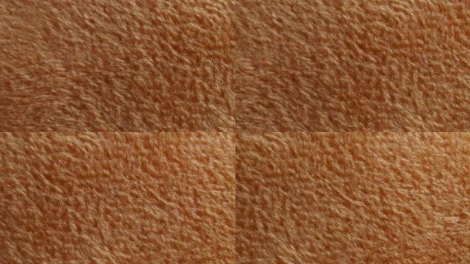 人造毛皮的宏观纹理。毛绒特写。棕色背景。
