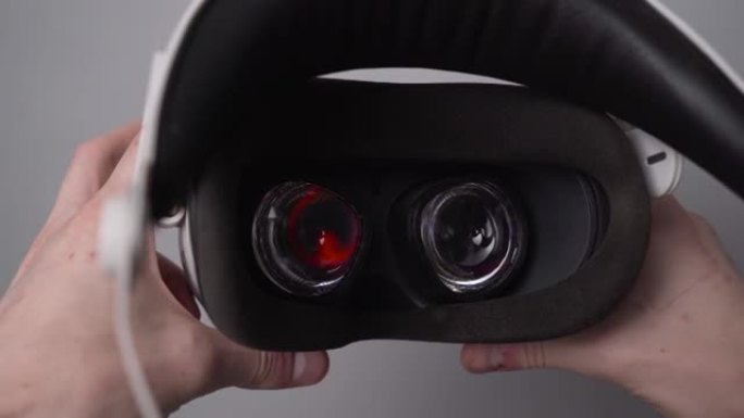 第一人称视角，一名男子戴上虚拟现实眼镜。戴上VR眼镜虚拟现实