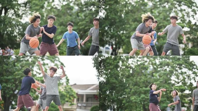 Z世代亚洲中国少年挑战球员，并在周末早上与朋友一起练习篮球比赛