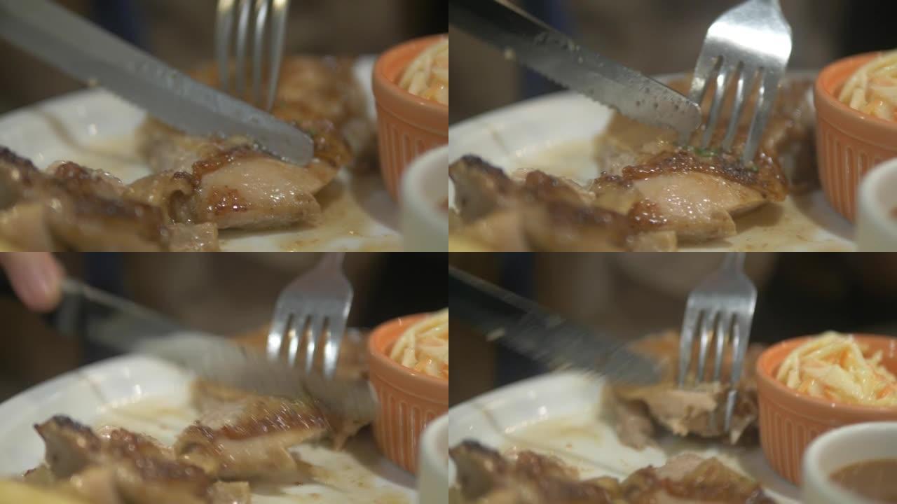 在白色盘子上切碎鸡排，身体部位。