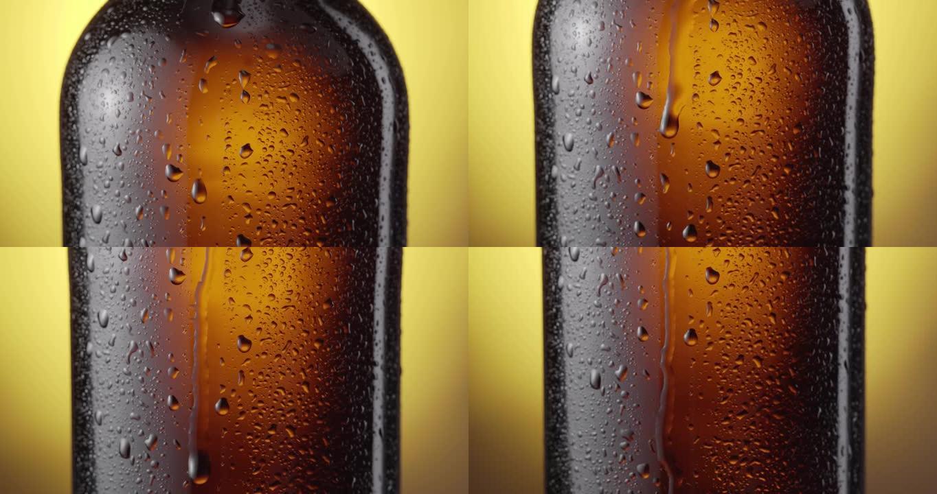随着相机的拍摄，啤酒滴慢慢滴落在烟雾弥漫的啤酒瓶中。黄色背景。