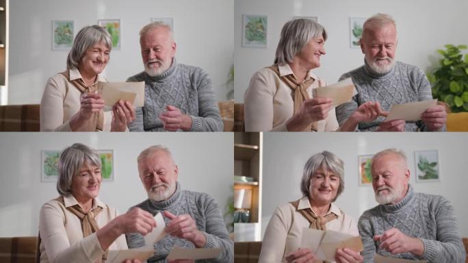怀旧，幸福的老年家庭夫妇享受回忆，白发男女在家里用照片看着旧相册