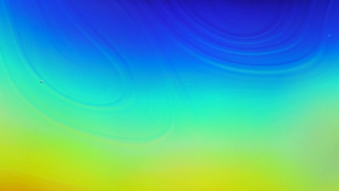 宏特写运动表面肥皂泡。蓝色，彩虹霓虹灯流动的液体波抽象运动背景。现代流体渐变混合生动时尚的霓虹色。鲜
