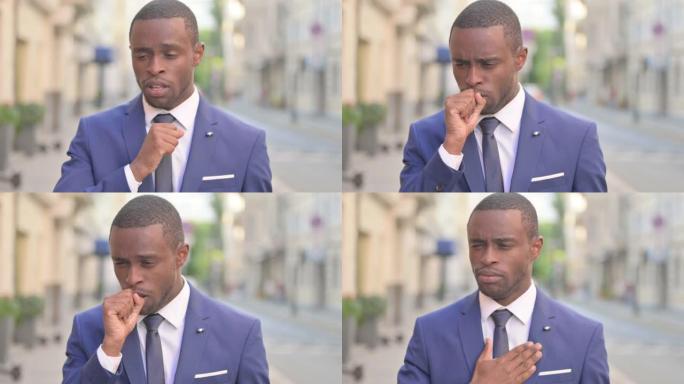 户外生病的非洲商人咳嗽