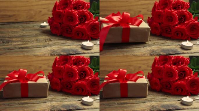 心爱的礼品盒束红玫瑰燃烧蜡烛木桌情人节