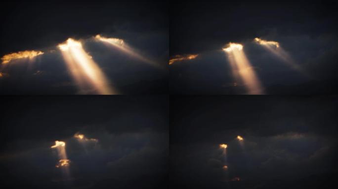 阳光倾泻穿过云层和神秘的天空，奇妙的光线