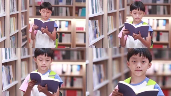 快乐的亚洲孩子在图书馆读书