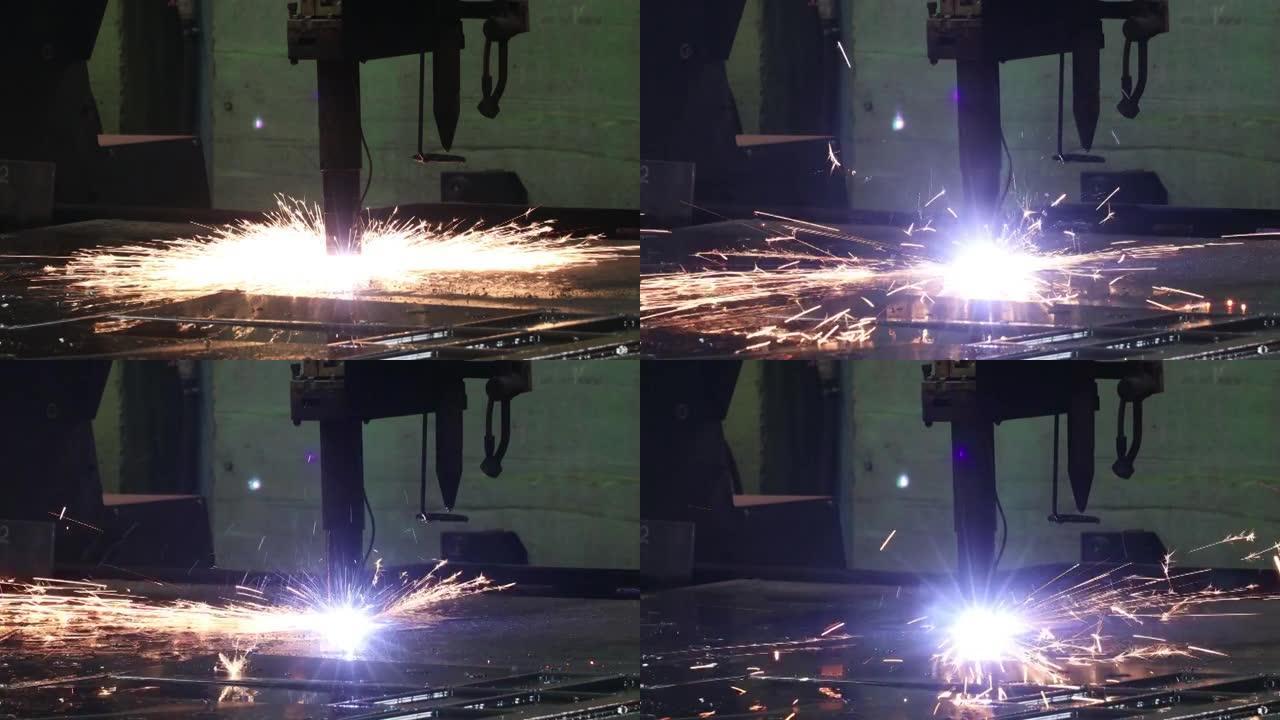 操作中的等离子切割机在工厂用火花将厚金属板切割成小零件