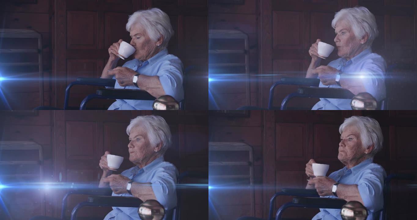 在轮椅上喝茶的微笑的白人白人妇女身上移动的灯光动画