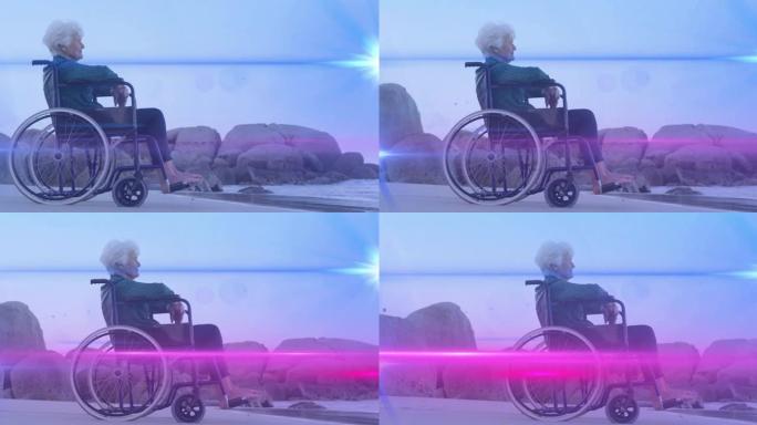 灯光在海滩上坐在轮椅上向海望去的白人妇女上移动的动画