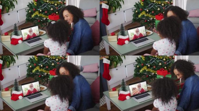 圣诞节期间，与圣诞老人进行视频通话的非洲裔美国母女快乐