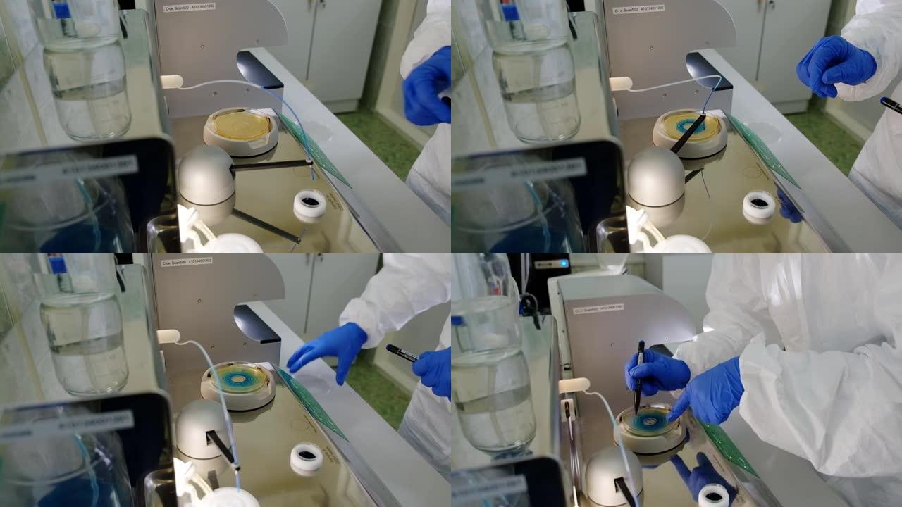 病毒学生物学家女人在实验室从事细菌的研究。它在现代设备上工作