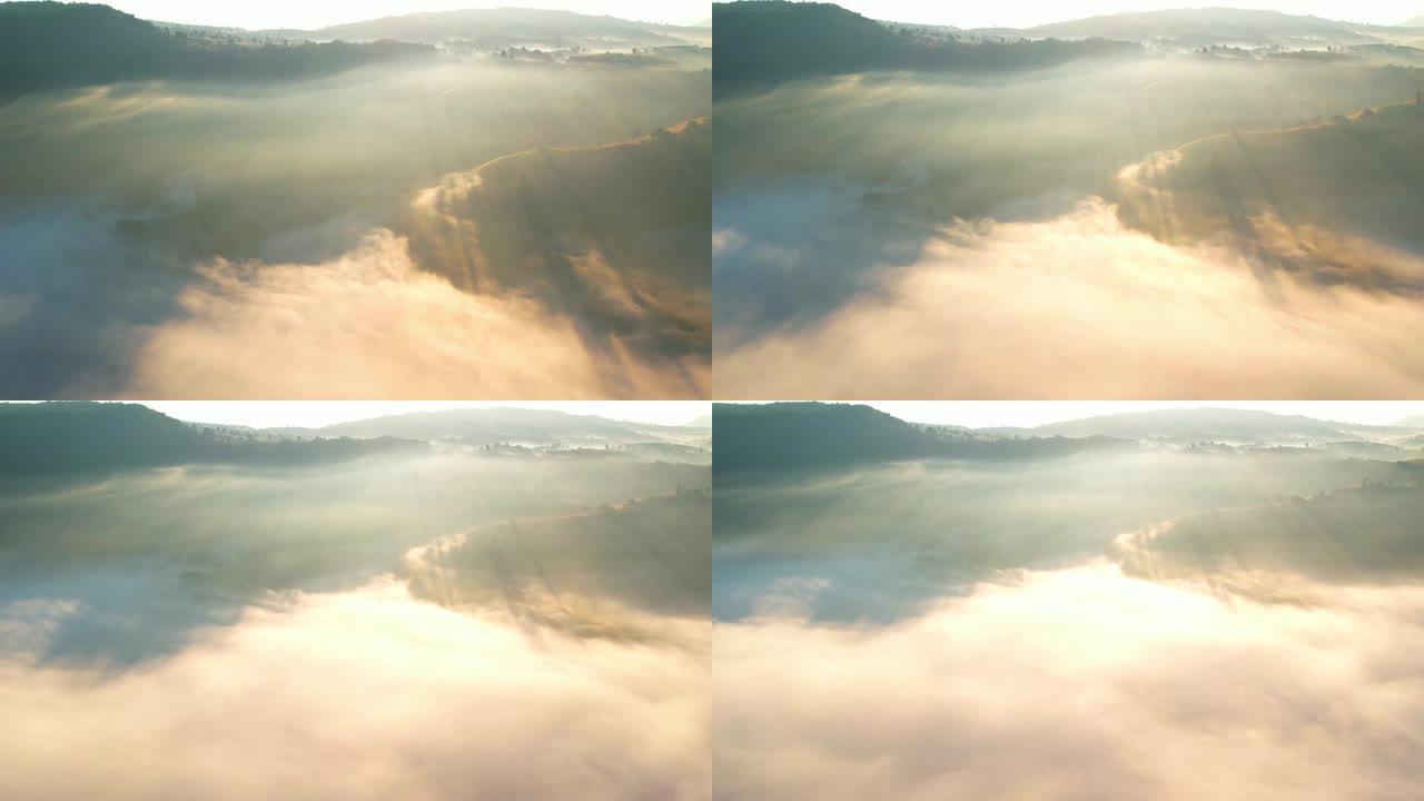 4k无人机在云中飞行。日出时飞越云层，无人机的空中顶部云景