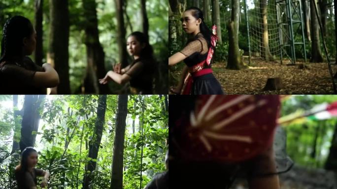 两个女人在森林里用传统的舞蹈动作互相搏斗