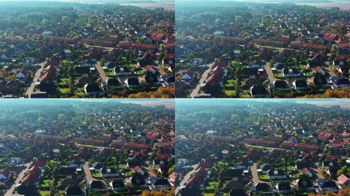 在德国郊区边缘飞行的鸟瞰图，街道和房屋在一个松散的发展