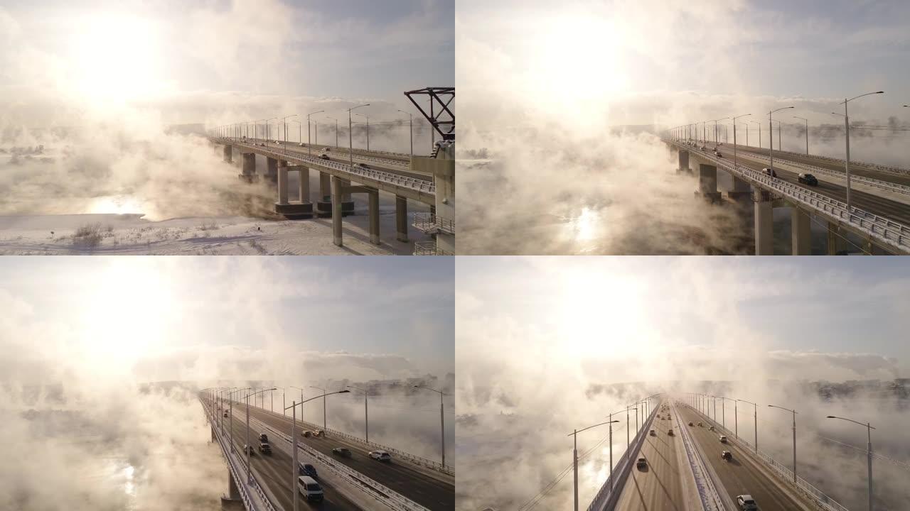 汽车在冬季蒸汽雾蒙蒙的lrrl河上过桥。孤独的汉加拉。Akademichesky上的汽车最多。在俄罗