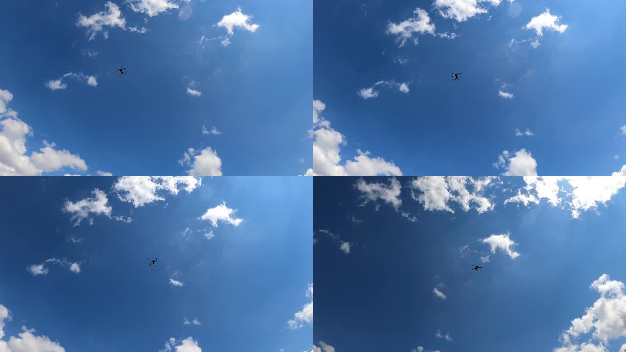 直升机装置在多云的蓝天背景上盘旋