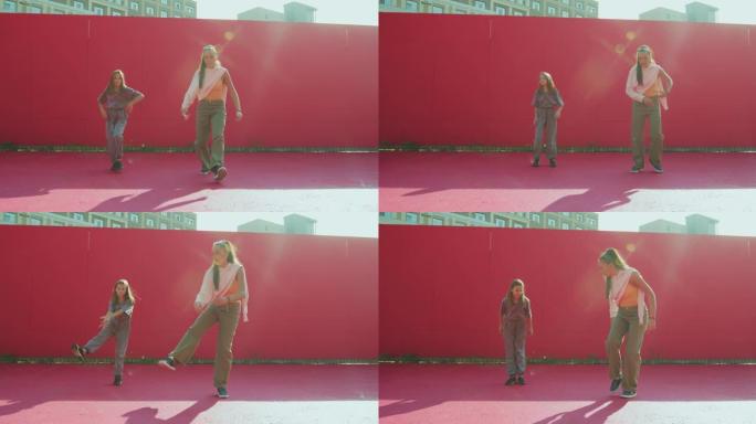当代舞蹈学校广告视频。女舞者教青少年女童在阳光下跳舞。