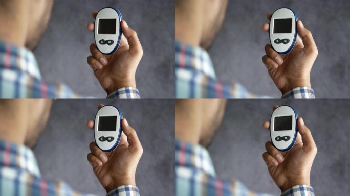 男人的手测量血糖水平
