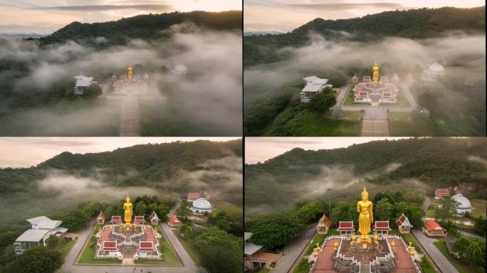 泰国宋卡府哈蒂区日出时山上大佛像周围移动雾的空中无人机超失效电影