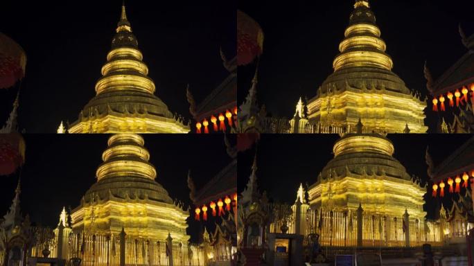 泰国南蓬夜间的phrahat Hariphunchai寺。