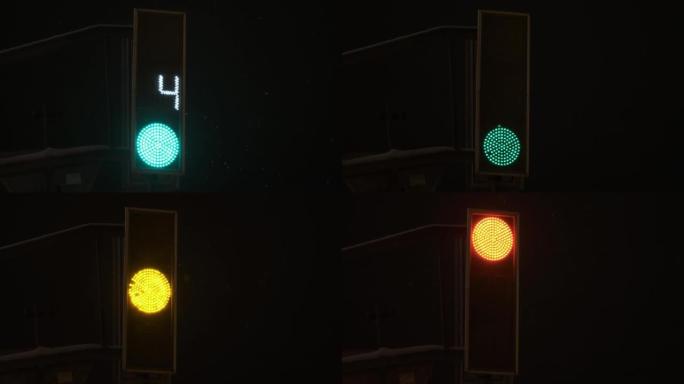 交通灯绿色倒计时。亮起红色。夜晚是冬天，正在下雪