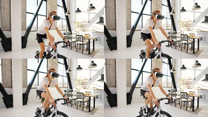 戴VR眼镜的年轻女性正在踩着室内健身车教练。工作室公寓，厨房。在家进行日常训练。慢动作