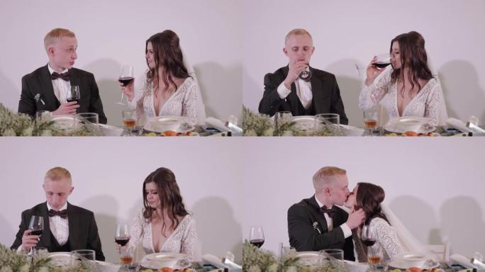 高加索新郎和新娘从酒杯中喝香槟或葡萄酒，在餐厅举行婚礼