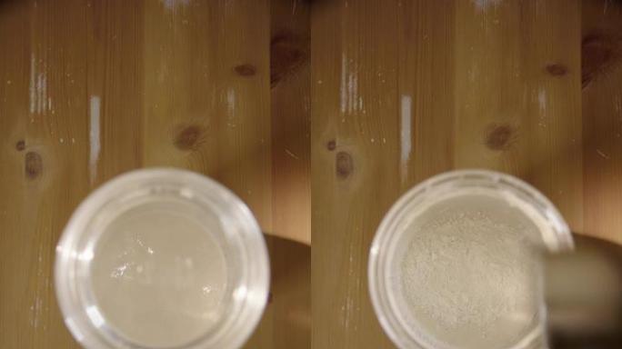 垂直，自上而下的酸面团发酵剂加入面粉和水