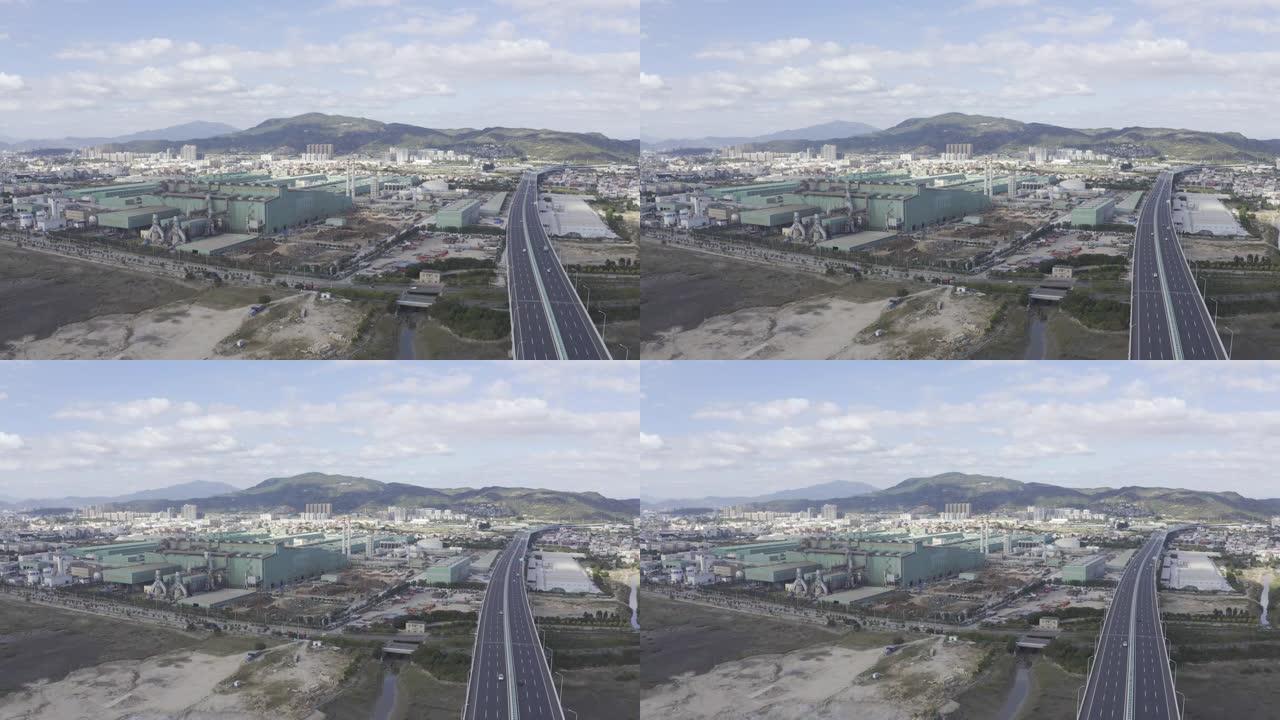 蓝天白云下高速公路和钢铁厂航拍视频