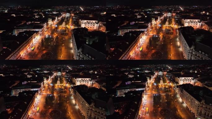 欧洲的夜大城市。飞越以不同颜色发光的街道。夜晚小镇的大道。夜间航空摄影。乌克兰的利沃夫市