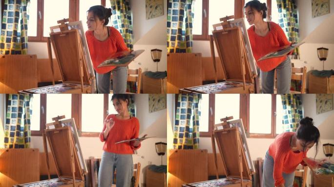 可爱的高加索女艺术家，在她舒适的家庭艺术工作室画布上绘画