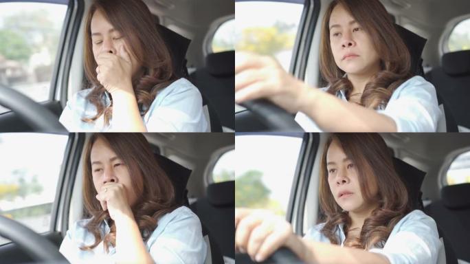 疲倦困倦的年轻女子在车内交通中打哈欠