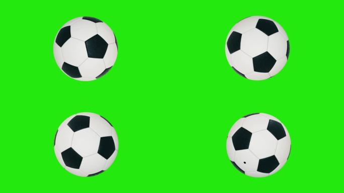 旋转足球隔离在绿色背景上。运动足球。色度键背景