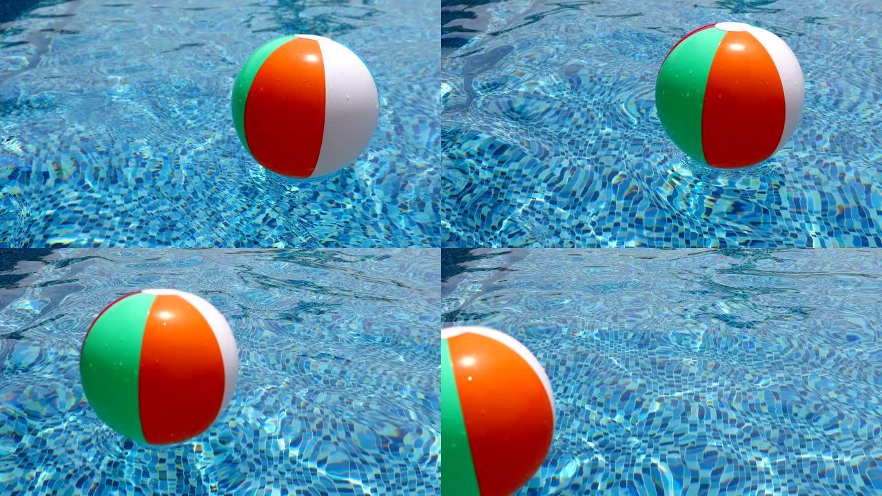 游泳池里的沙滩球。游泳池中漂浮的彩色充气球。