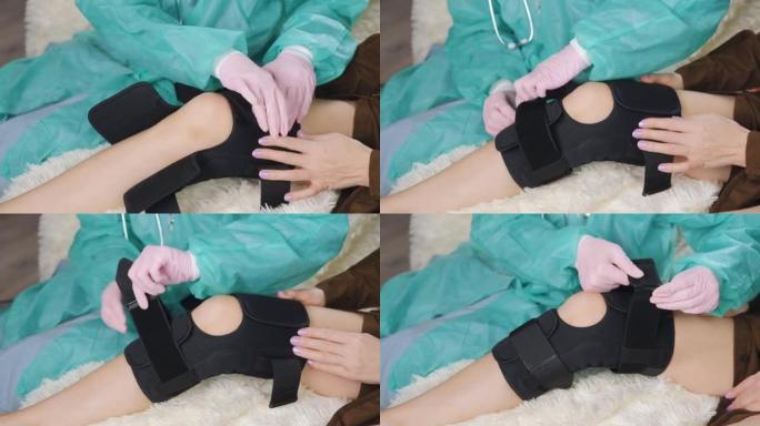 一名戴着医用手套的医生在病人受伤的腿上套上特殊的医用绷带。