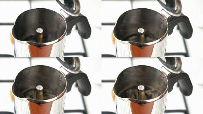 咖啡煮沸后流过moka pot咖啡机的孔。
