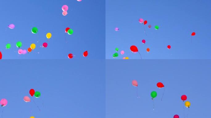 五彩气球在蓝天上飞起来。