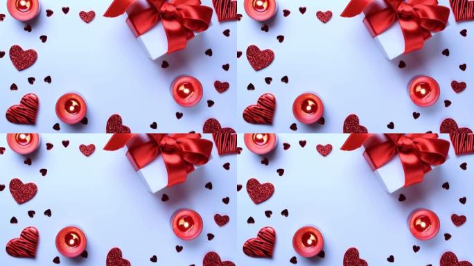 情人节作文: 红色的爱心，浪漫的礼盒，白底蜡烛。2月浪漫礼物卡。顶视图。从上方观看。