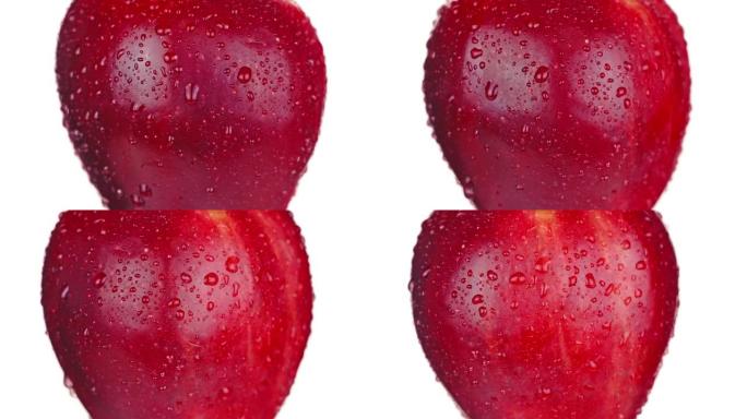 多汁的红苹果，水滴变成白色的左侧