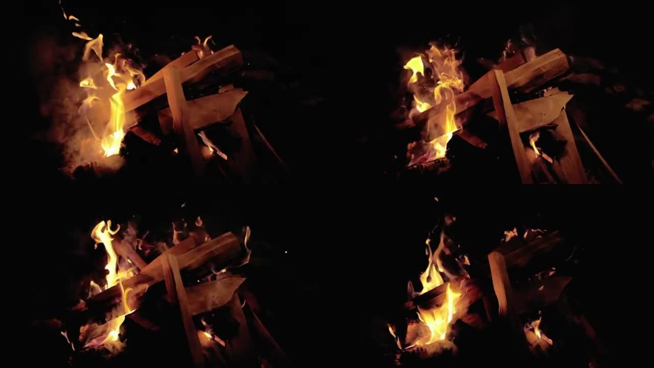 令人兴奋的视频，燃烧着火花和粒子的篝火。