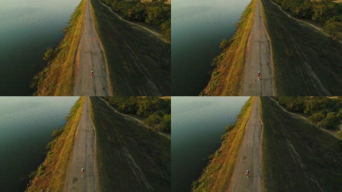 湖附近奔跑的人的无人机镜头