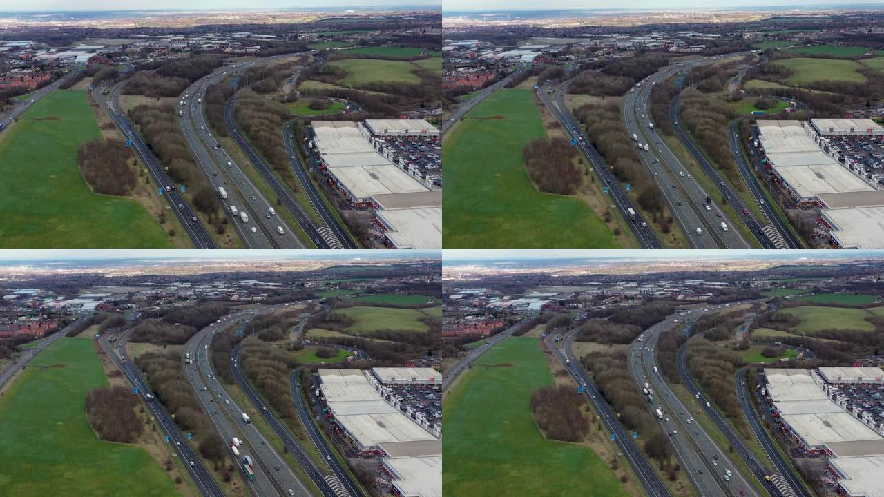 位于购物中心附近的Birstall镇附近的M1，M62和M62高速公路的航拍镜头，宜家展示了典型的英