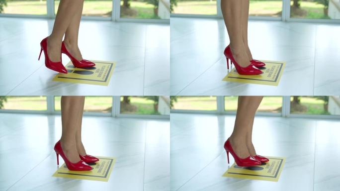 超级慢动作，穿着红色鞋子的女性与他人保持距离1米保持距离，防止新型冠状病毒肺炎病毒，社交距离概念。