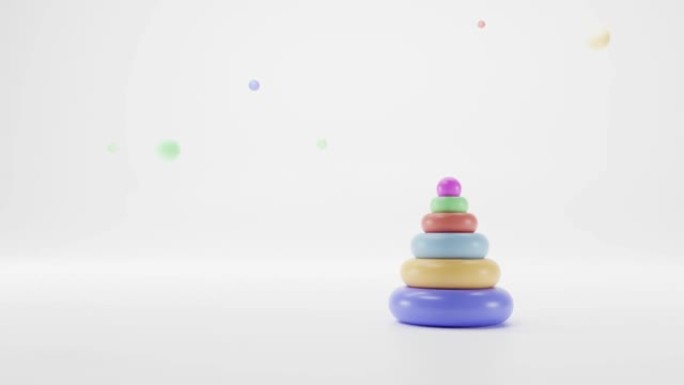 儿童玩具从彩色木环，金字塔在白色孤立的背景与球。堆叠玩具，婴儿和幼儿的戒指，以学习精细的运动手部技能