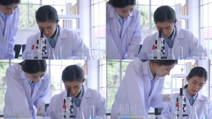 女人和同事在实验室做医学研究