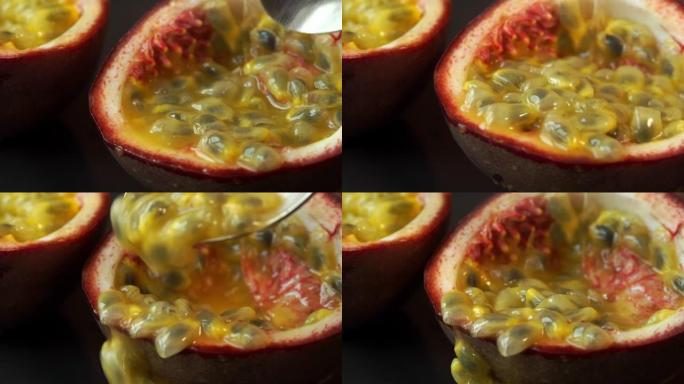 用多汁成熟的谷物切成半个百香果，将汤匙关闭。热带，异国情调，新鲜水果概念。热带水果背景