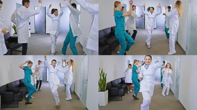 在现代医院走廊休息时间医生和护士团队跳舞和微笑大感觉非常兴奋和快乐